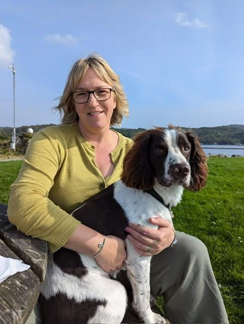 Sarah, who runs Luminar Glass Studio, with her dog